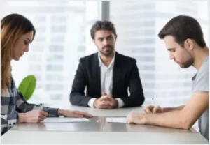 A couple attending a divorce meeting with a lawyer.