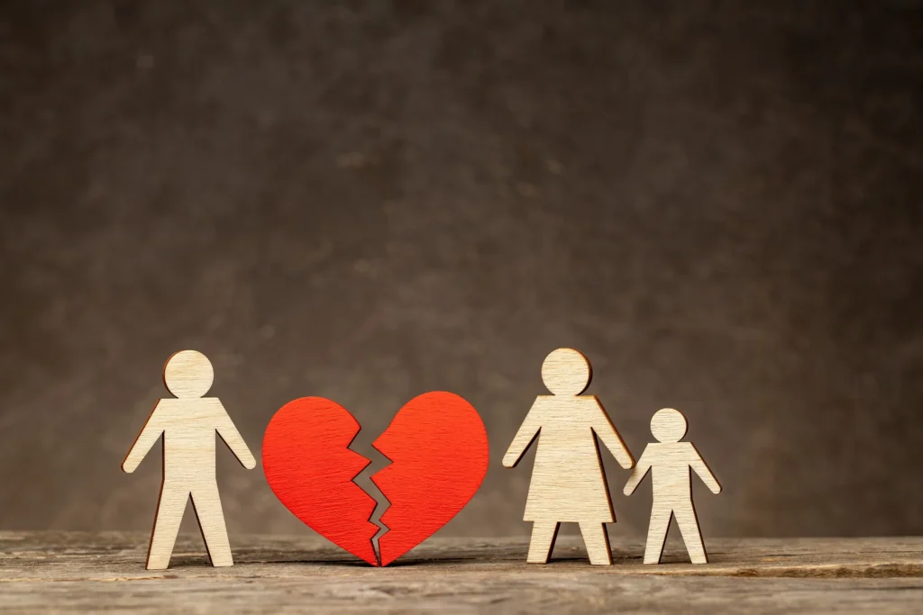 Papercut outs of a family with a broken heart.