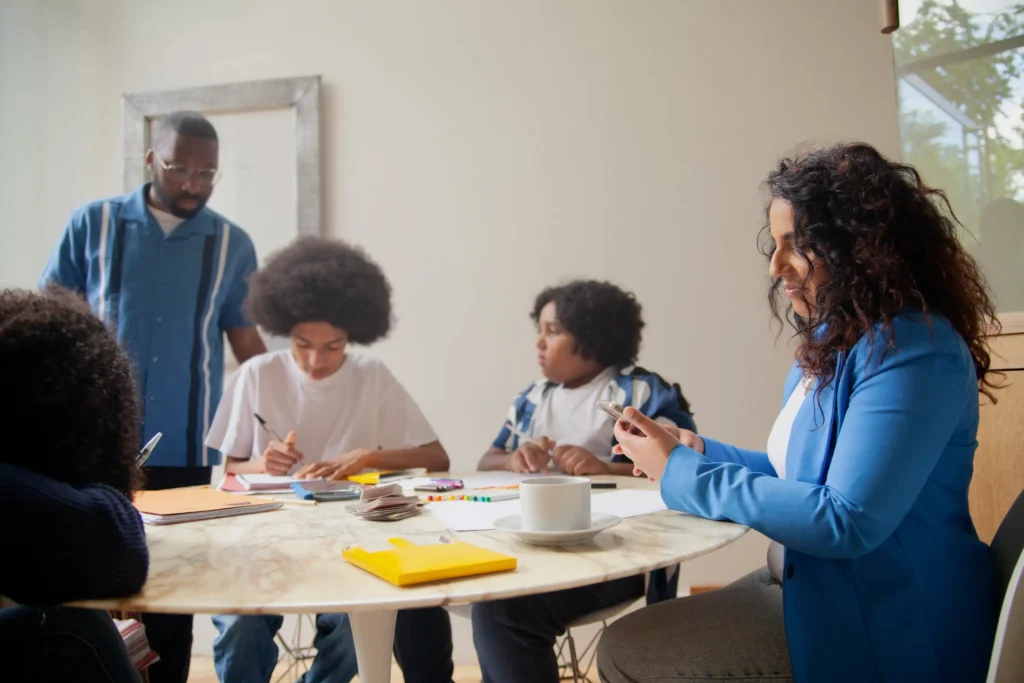 A family sitting at the table talking.